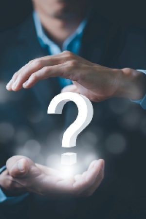 Ask question online concept, Businessman hand hold interface question marks sign web, Question marks drawn on black background. Concept of searching for an answer, Uncertainty and problem solving.
